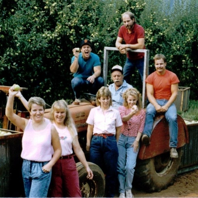 Family hanging out on a tractor
