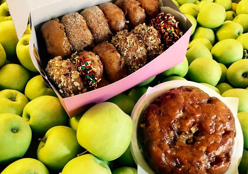 box of doughnuts and apples